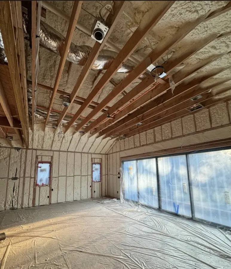 Interior walls and ceiling insulated with spray foam during new construction in Iola